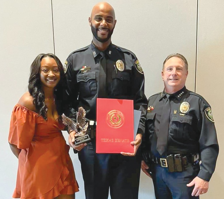 2024 Humble PD Officer of the Year Robert King with Jessica King and Humble Chief of Police Ken Theis.